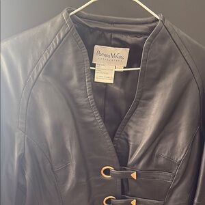 Pamela McCoy Black Leather Jacket with Sleek Modern Cut